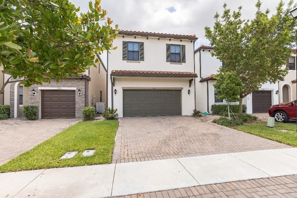 Photo of 5036 Laurel Oak Dr, Riviera Beach, FL 33410 (MLS # F10328127)