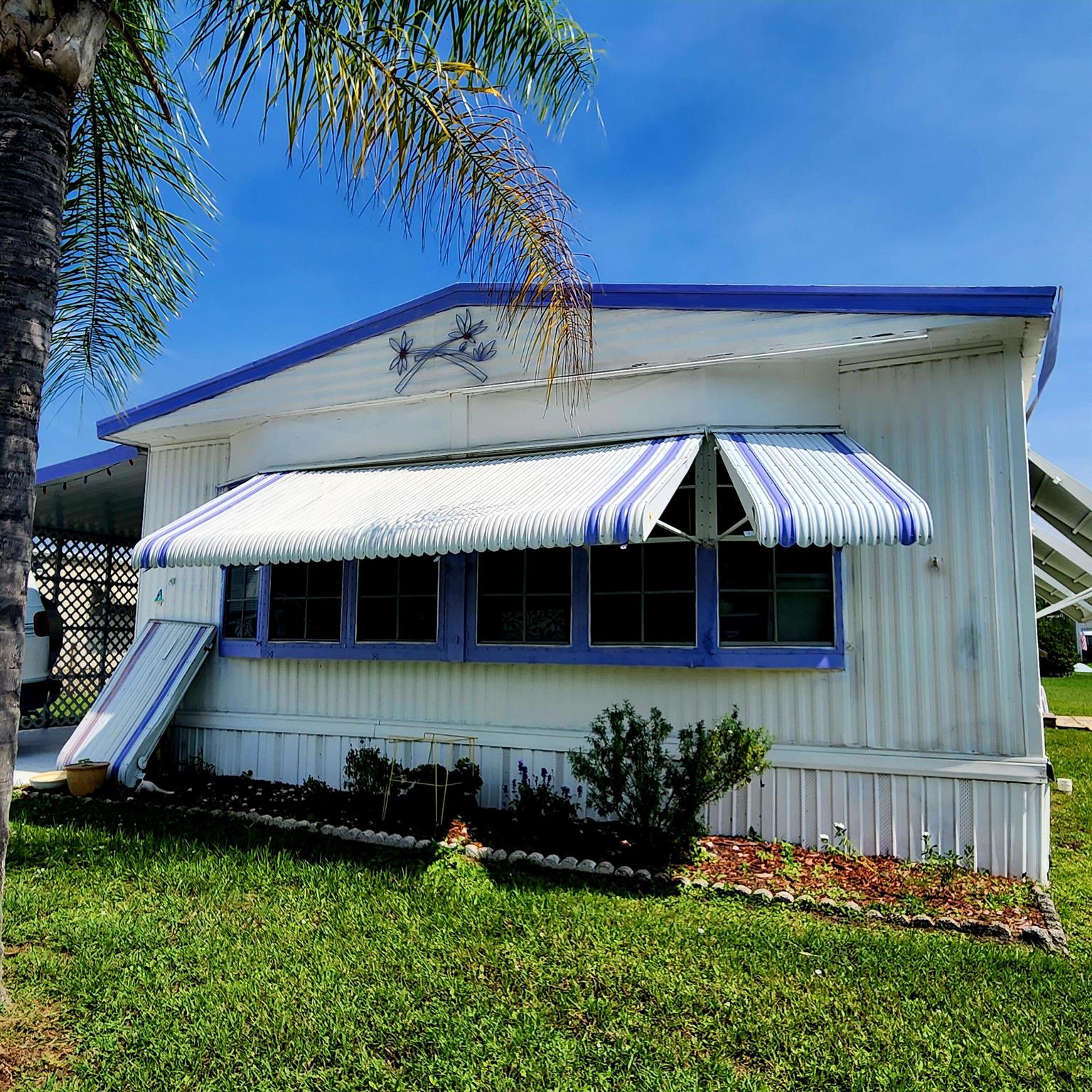 Charming, furnished, 2 bed/2 bath home in a 55+ community. Huge Florida room perfect for an office, 2nd living room or extra bedroom. AC 2019. You will be pleased w/ this prime location; close to the beach, grocery stores, shopping, post office, banks, hospitals & more. Lot lease of 930.98 covers Security, Cafe, Clubhouse w/activities, lawn care, trash, private golf course (no fees to play), Bingo, heated pool, pickleball, tennis, shuffleboard, bocce, gym, library, cards, Mahjong, clubs & more! Grab your slice of paradise in the highly desired town of Port St Lucie!