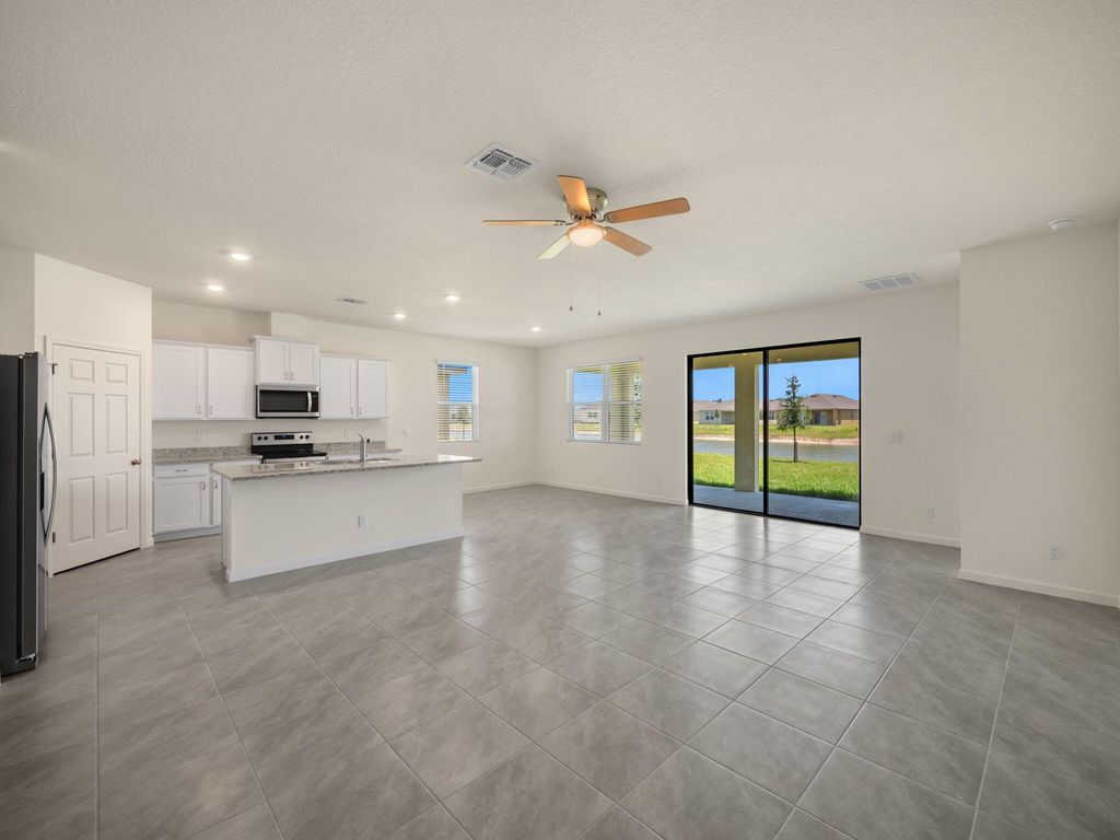 Photo of 9797 SW Triton Way, Port Saint Lucie, FL 34987 (MLS # R10986793)