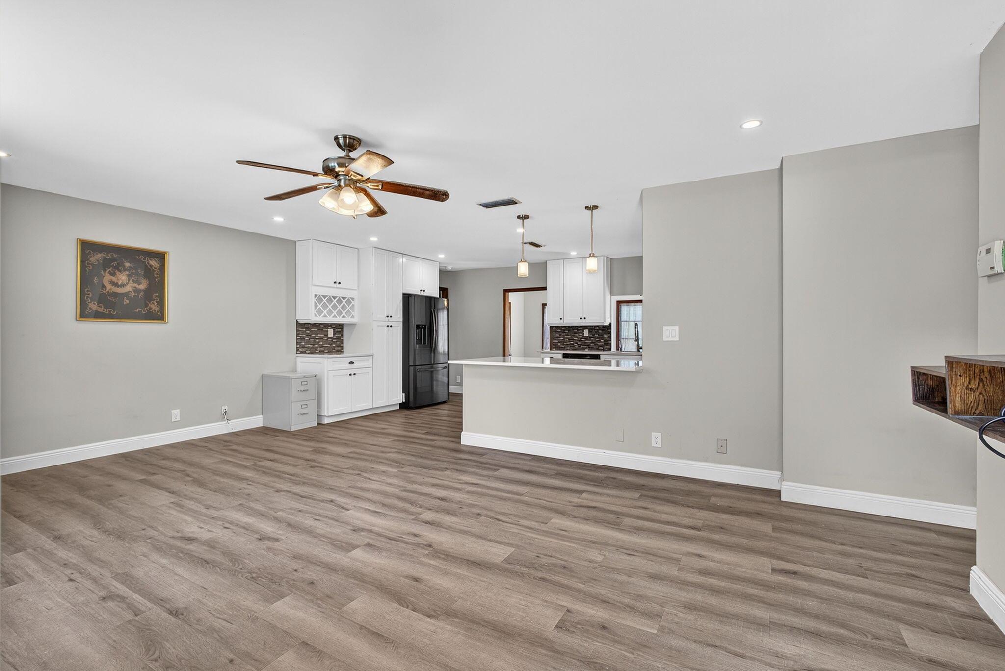Welcome to this beautifully remodeled 3-bedroom, 2-bathroom home that blends modern design with comfort and functionality. The spacious open kitchen is a showstopper, featuring sleek quartz countertops and a layout perfect for both everyday living and entertaining. Both bathrooms have been thoughtfully updated with stylish finishes, creating a fresh, spa-like feel. Enjoy peace of mind with a brand new 2024 roof, a 2019 AC, whole-house osmosis system, and a tankless water heater installed in 2025. Step outside to your expansive property, unwind by the tranquil pond, or entertain in the gazebo--complete with power for a TV and fridge. The home also includes a 1-car garage and room for your boat, RV and more. This one is truly move-in ready--schedule your tour today!