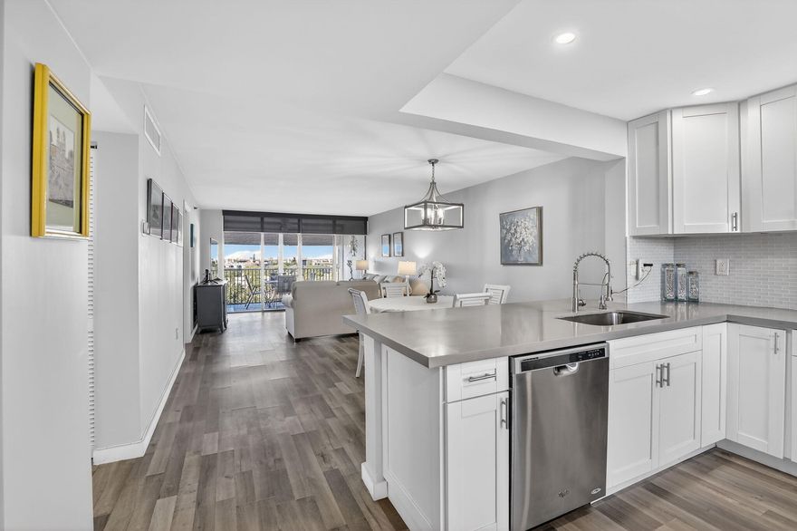 Beautifully renovated top-floor (8th Floor) 2-bedroom, 2-bath condo in 55+, gated community with over 1,200sqft of living space! Completely updated with ALL NEW LVP flooring throughout, NEW HVAC, NEW electrical panel, NEW tankless water heater, NEW lighting, NO popcorn, steel front door and in-unit washer/dryer! Thoughtfully designed and beautifully decorated, this home is sold FURNISHED and move-in ready! Open concept kitchen features quartz counters, SS appliances & plenty of white Shaker cabinetry! Relax on your screen back patio & enjoy the beautiful sunset views! HOA included cable, water, & internet, plus tennis courts, pool, clubhouse, community room, fitness center & more for easy resort-style living!