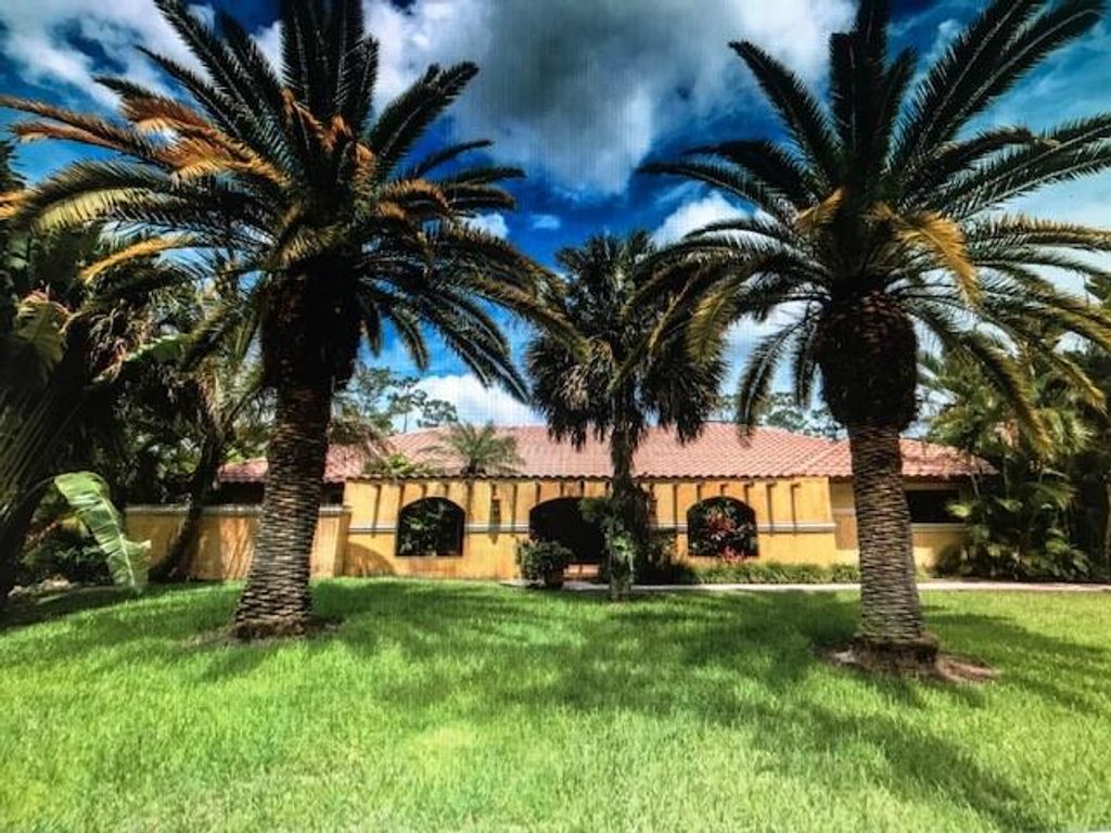 Photo of 6004 NW 65th Ter, Parkland, FL 33067 (MLS # F10290944)