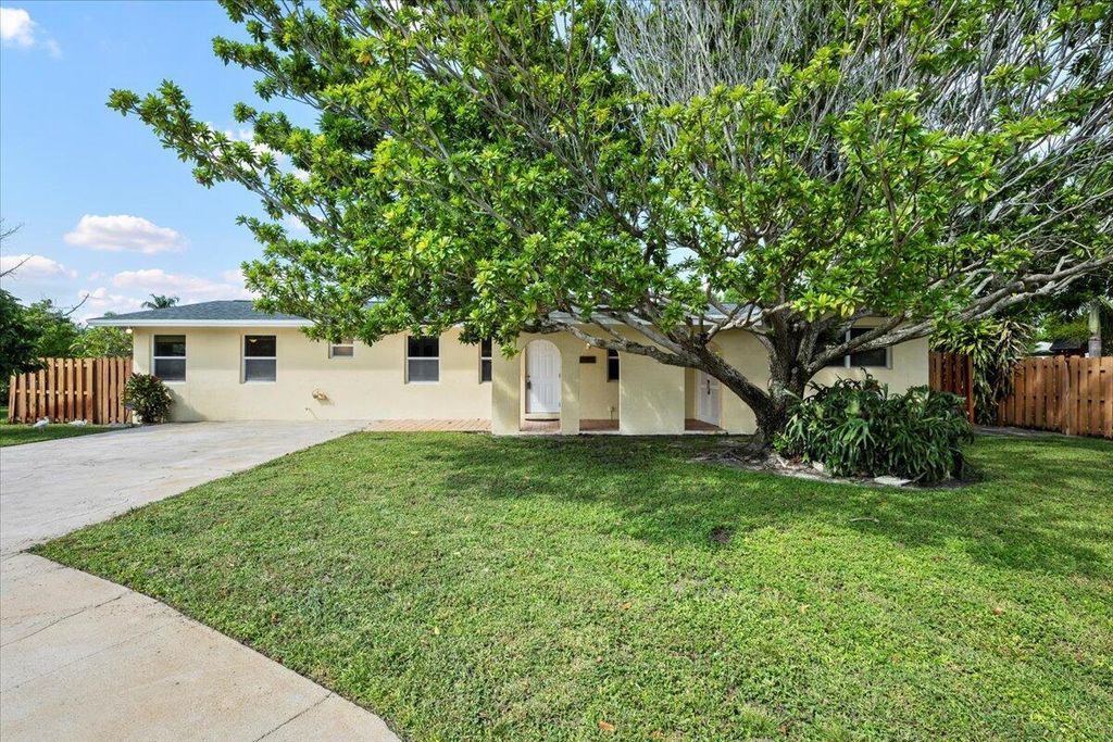 Photo of 1409 Richard Lane, Lake Worth Beach, FL 33460 (MLS # R11133833)