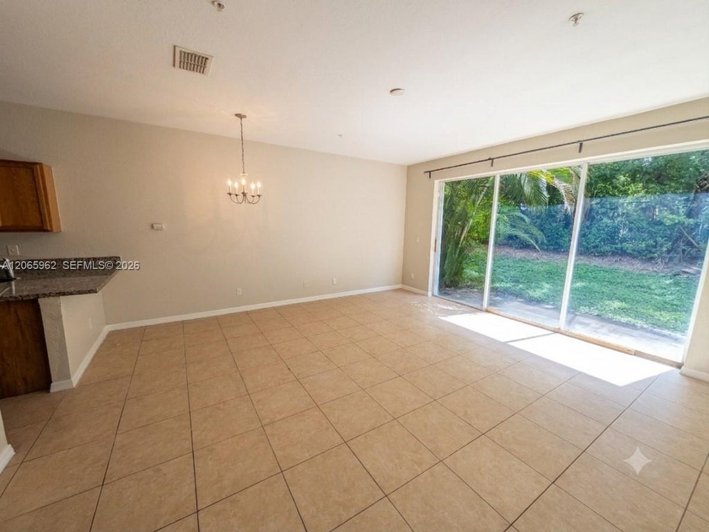 Photo of 911 Pipers Cay Drive #52, West Palm Beach, FL 33415 (MLS # A12065962)