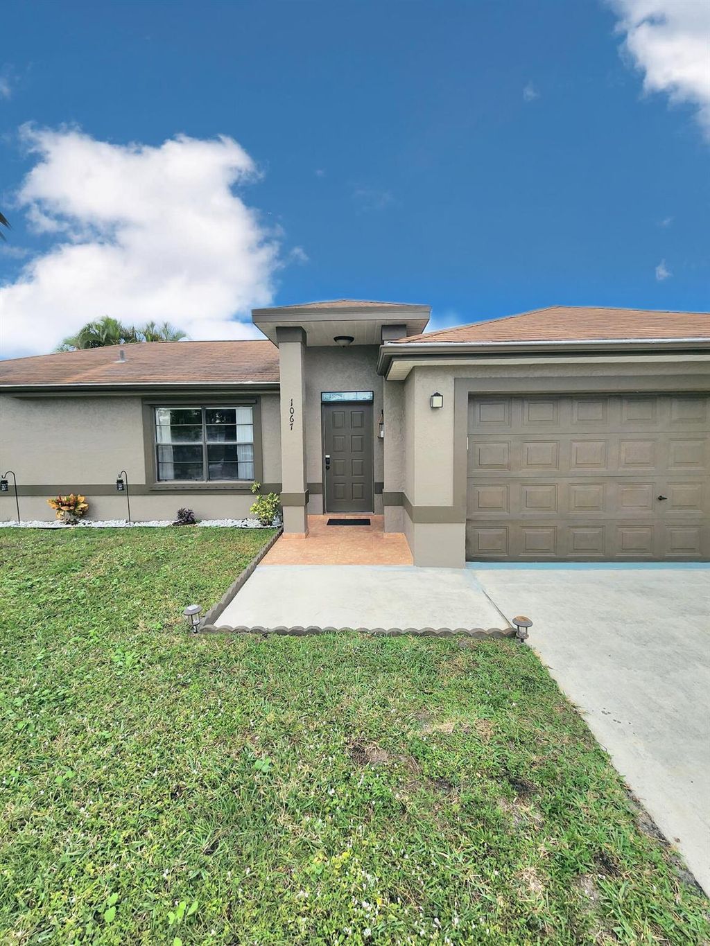 Photo of 1067 SW Paar Drive, Port Saint Lucie, FL 34953 (MLS # R10948371)