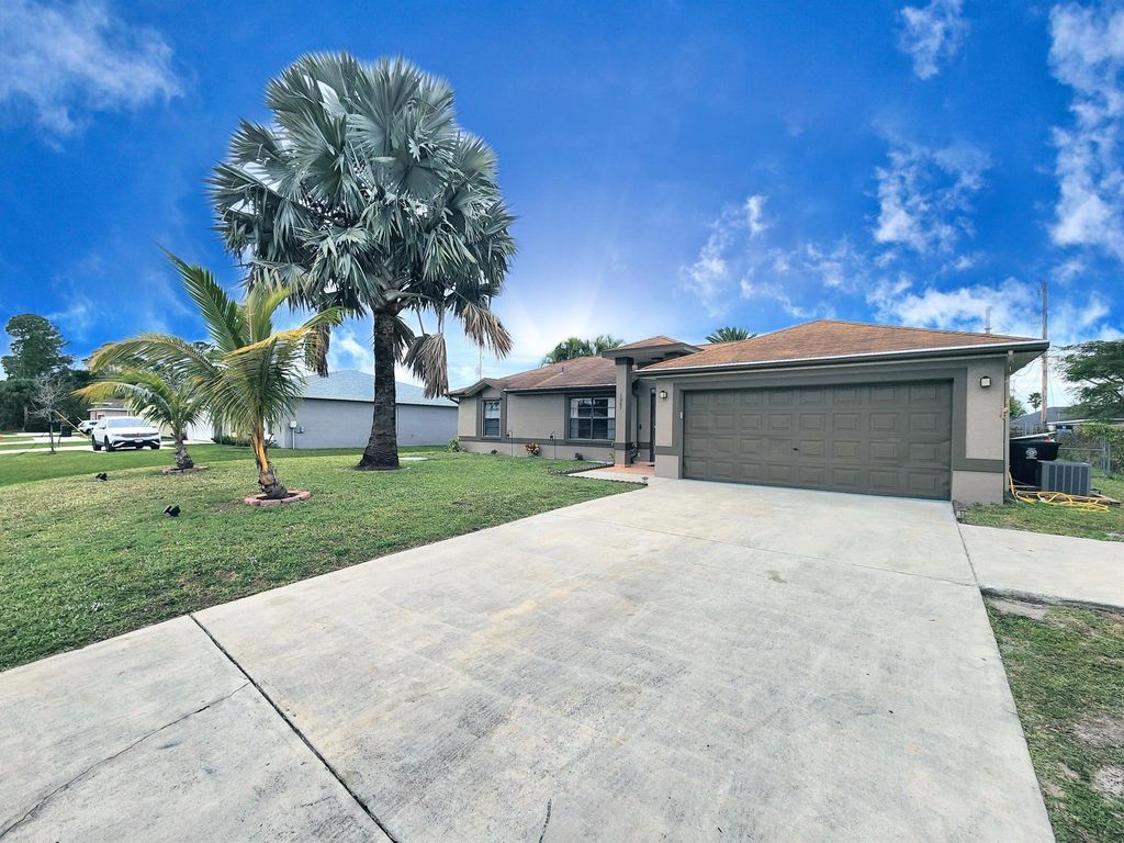 Photo of 1067 SW Paar Drive, Port Saint Lucie, FL 34953 (MLS # R10948371)