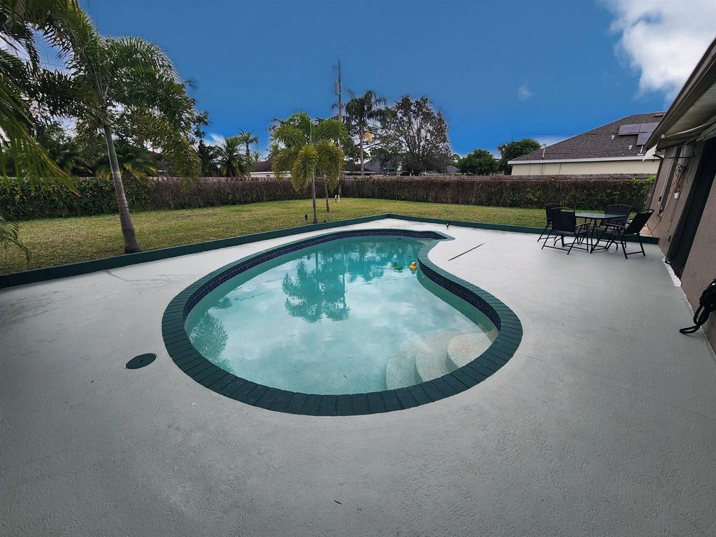 Photo of 1067 SW Paar Drive, Port Saint Lucie, FL 34953 (MLS # R10948371)