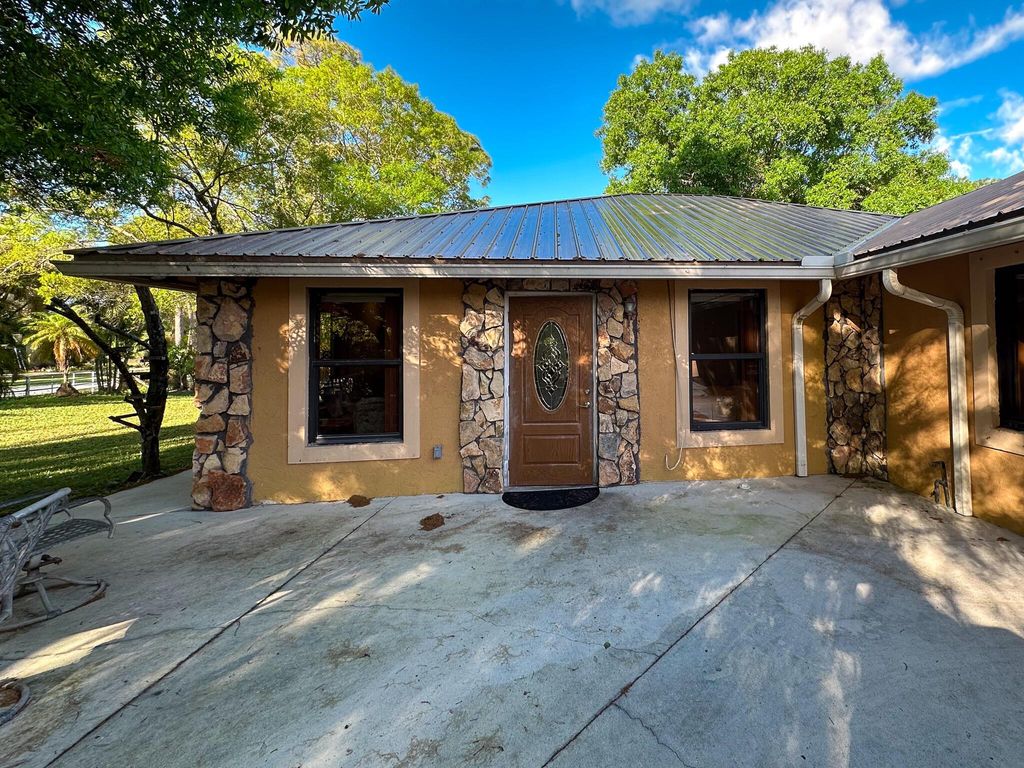 Photo of 12895 54th Street N, West Palm Beach, FL 33411 (MLS # R11024742)