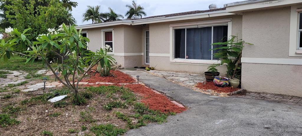 This is a true diamond in the rough with lots of great potential in a wonderful neighborhood!!! Widow is ready to move forward and can not do the repairs on the property. This is perfect for that handy person that wants to work on a great house with good bones that just needs some TLC to make it their own amazing home!!! AC is only 2 years old, water heater is 3 years, washer is 4 years. All stainless steel kitchen appliances. Propane gas range and dryer with direct gas access to hook up outside gas grill and hook up is there for a direct gas generator too. Large pie shaped lot with big front yard is perfect for a circular driveway and lots of parking. This home is so close to I-95 and PB airport as well as great parks, playgrounds, a dog park, zoo, science museum and much much more!!!