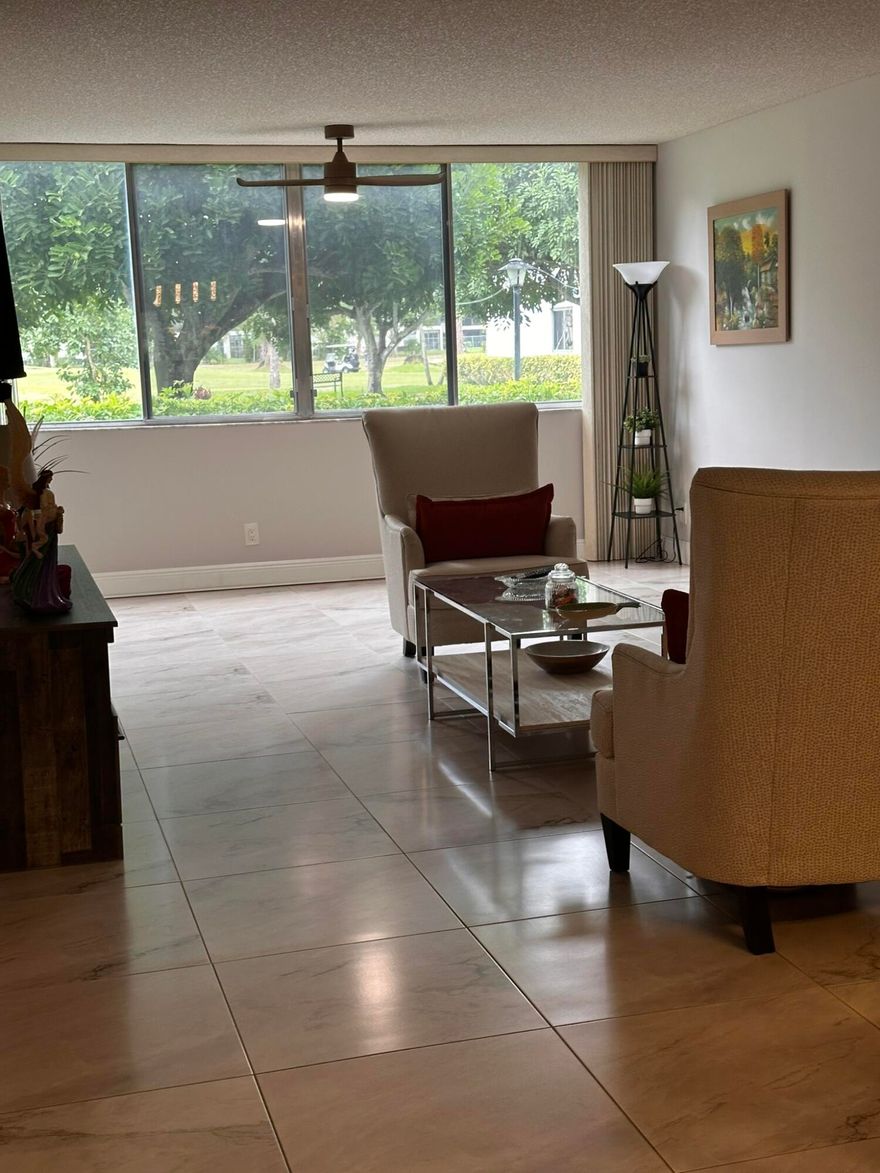 Great 1.444 sf unit on first floor 2/2 plus a bonus room that can be used as hobby room or storage. This Condo it's all tiled up and renovated,with light color walls.the kitchen with granite counters,and SS,2 years old appliances. Large primary suite featuring a walk-in closet and modern bath.Ready to move in!!! Very active 55+community with pay as you play Golf Course,lower HOA than most communities at the vicinity. Very nice club house,with gym and 2 pools,countless amenities, new roof in 2024, nice view of the garden and pool! Accordion shutters.Maintenance fee covers all you could think of, such as water, cable, internet, pest control. Conveniently located near shopping, dining, and major roadways. Don't miss your chance to own this exceptional unit. Schedule your showing today!!!!