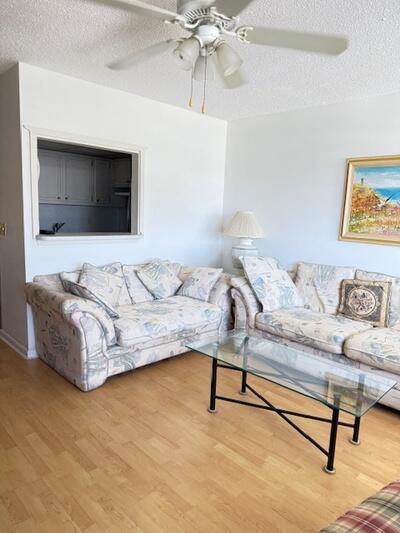 ACTIVE 55+ COMMUNITY - Enjoy a beautiful water view from this furnished condo featuring newer appliances, Pergo flooring, and carpet. Building includes a lift for added convenience. Located in a 24-hour gated, active 55+ community with a clubhouse, fitness center, pools, tennis, pickleball and more!