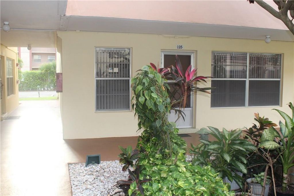 Photo of 3071 NW 47th Terrace #125, Lauderdale Lakes, FL 33313 (MLS # B26037629)