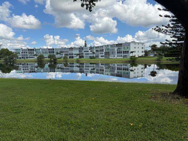 Very desirable first floor unit open floor plan. Updated finishes, Impact glass all openings. Beautiful lake view. Nicely furnished, move in condition. Century Village offers the finest in 55 plus amenities with its massive clubhouse featuring a 1500 plus seat theater with live shows and movies. Courtesy shuttle. security guard gated community, tennis, pickle ball, art workshops, wood shop, stained glass shop, card rooms, ball room, fitness center, clay room, billiards and so much more. You'll love this place!