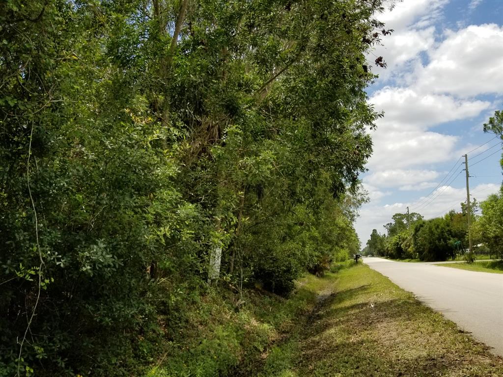Partially cleared., driveway culvert, electricity on property. Prime 2.1 high, dry acres in Jupiter Farms! Beautiful fenced lot with many tall pine trees, surrounded by nice homes. Canal on North border for privacy and miles of trails. On paved road conveniently located close to elementary school, Publix, I-95/Turnpike and the gorgeous Riverbend Park. Perfect property for your dream estate, horse farm or to simply enjoy country life with city conveniences.
