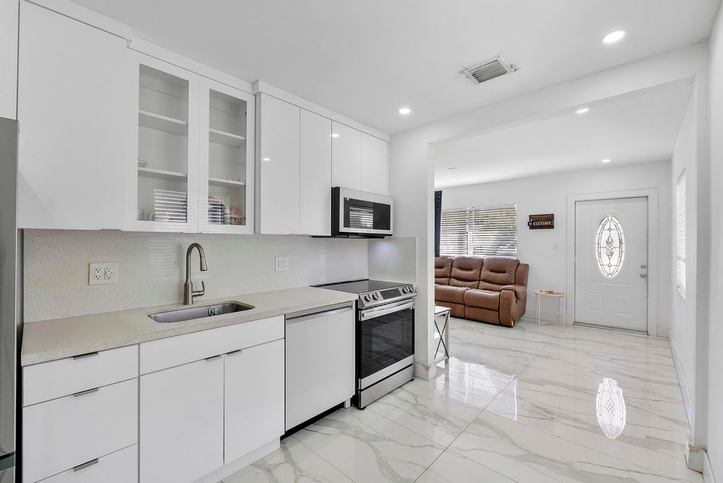 Photo of 3125 SW 12th Place, Fort Lauderdale, FL 33312 (MLS # B26003159)