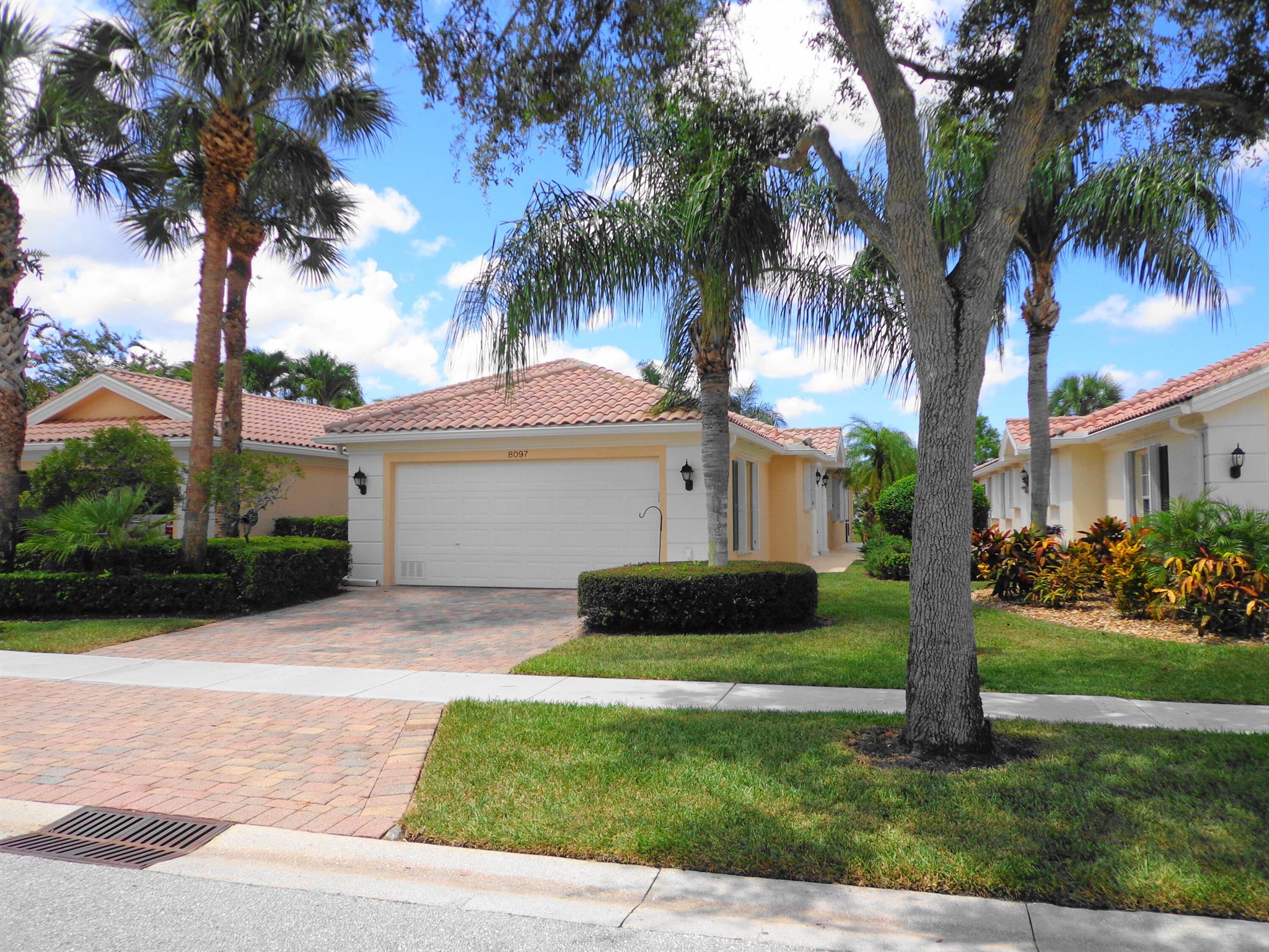 Resort style living - Gated community offering tennis, pickleball, pool and more. Water views and walking trail. Beautiful well maintained home with split bedrooms, family and living rooms, screened patio, two car garage, hurricane accordion shutters.