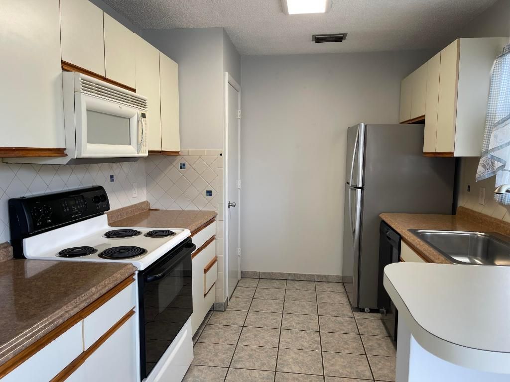 Photo of 9 Lake Vista Trail #101, Port Saint Lucie, FL 34952 (MLS # R10954782)