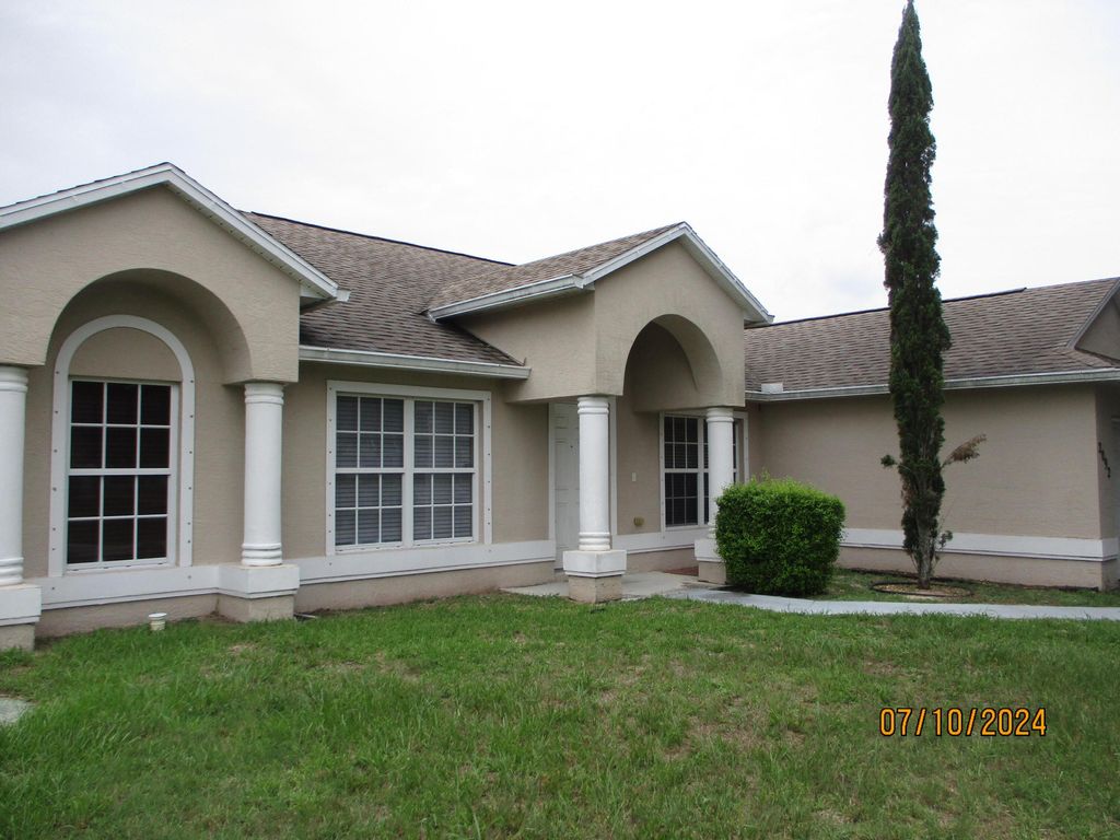 Photo of 2092 SW Pruitt Street, Port Saint Lucie, FL 34953 (MLS # R11009273)