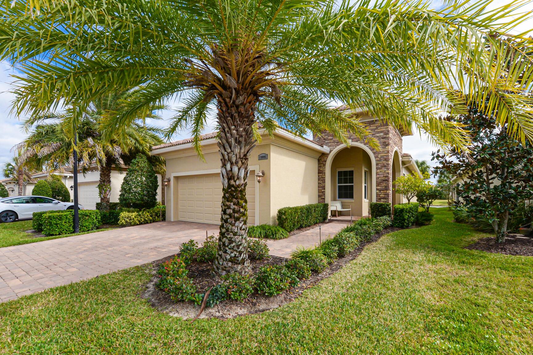 Beautiful ''Casita Model'' in Verano PGA Village. Features CBS Construction, Barrel tile roof, paver driveway/walkway, Hurricane impact Windows & doors & Wonderful LAKE VIEW! Front Patio & decorative etched glass door. Hosts 2 BR's, 2 BA's, Den, 2 CG w/ Epoxy flooring & spacious covered patio overlooking tranquil lake View. Porcelain tile in main areas & den that looks like wood & wood floors in BR's. Volume Ceilings, Open Floor Plan & lovely kitchen include large Island, upgraded 42'' cabinets, Stainless steel appliance's, pantry, pendulum lights & granite counter tops. Split BR's with spacious Master Suite, natural lighting, walk in closet & beautiful MB offers dual sinks, frameless large shower with tile to ceiling. Laundry Room has washer, dryer, cabinets & sink. GOLF CART INCLUDED!