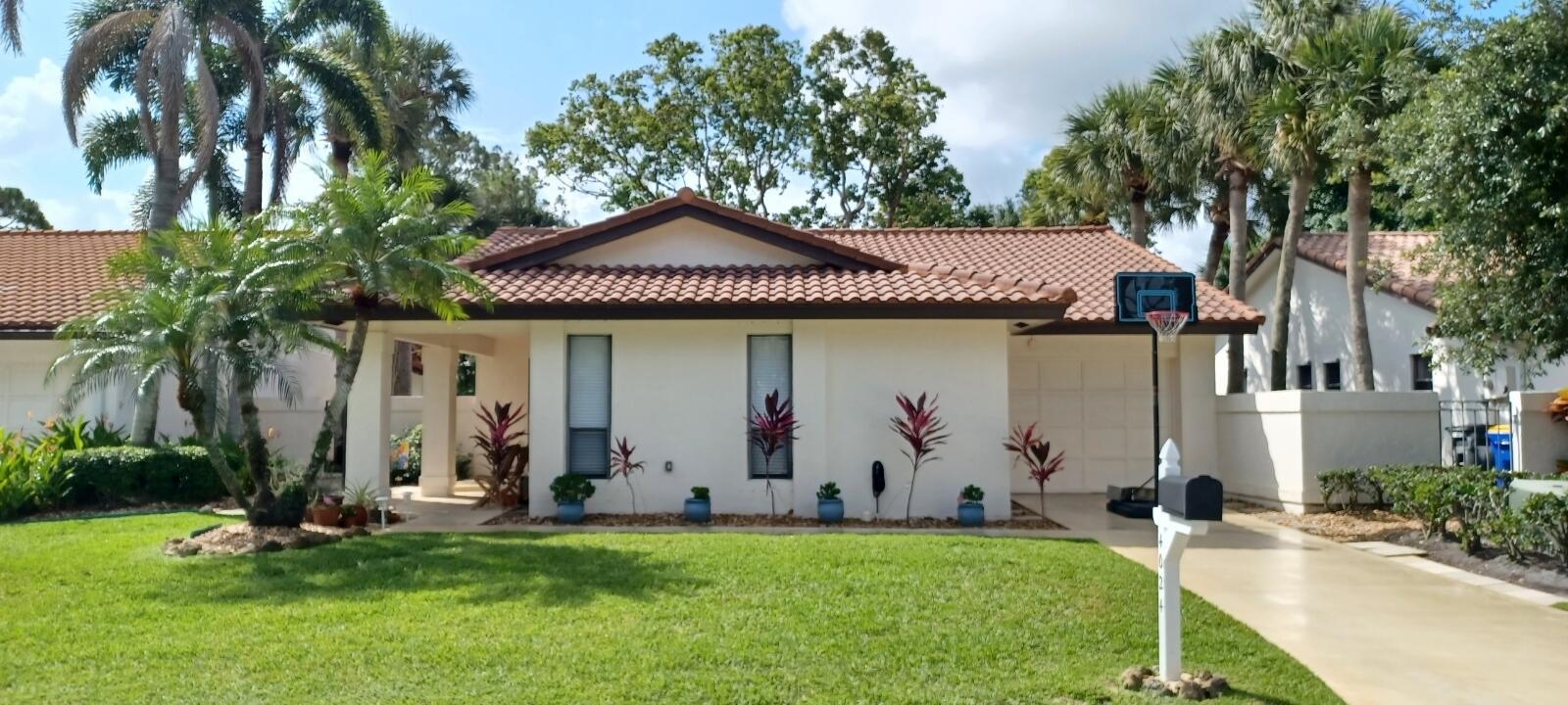 Welcome to this beautifully maintained 3BR, 2BA home in the sought-after Osprey Creek community of Martin Downs. Enjoy scenic views of the 18th hole from your tree-lined backyard, offering both beauty and privacy. Golf enthusiasts will appreciate the community's access to both public and private golf courses, with clubhouse dining just steps away. The home features a 2015 roof, wood-look vinyl floors, a spacious living room opening to a screened porch, and a kitchen with built-in pantry and ample counter space. Located minutes from beaches, Intracoastal, horse trails, and more. Low HOA includes gated security, cable, internet, and lawn care. Move-in ready for any family size and ideally located for relaxed, active living.