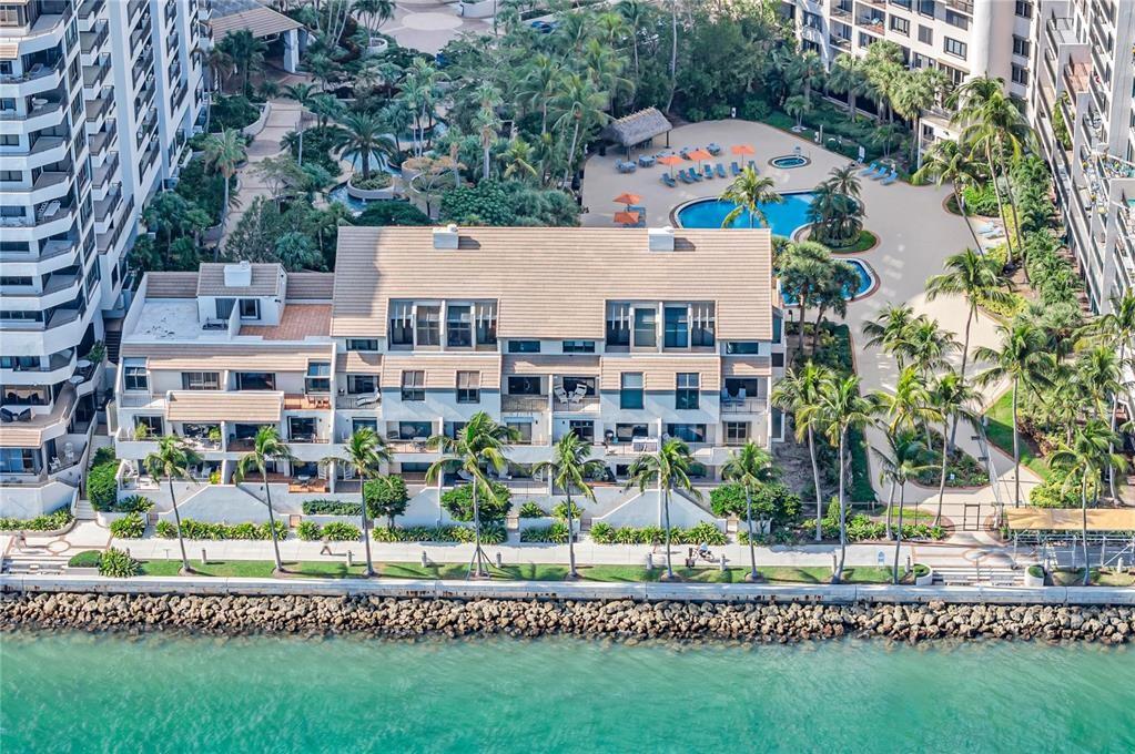 TWO-STORY OCEANFRONT Bay Home on exclusive Brickell Key Island with unobstructed OCEAN VIEWS. Currently undergoing a complete gut renovation. This 3 BEDROOM/3.5 BATH residence is currently being rebuilt with all new core systems: electrical, plumbing, & a high-efficiency HVAC with linear vents, enabling dramatically raised ceilings throughout. Features include a new private elevator, full impact glass, 30x60 porcelain floors, custom millwork, & a chef's kitchen with a full Thermador appliance suite. All closets, railings & bath fixtures are new. This is your chance to own a brand-new, two-story trophy property on the exclusive island of Brickell Key. An irreplaceable offering combining private bay access with the vibrant energy of Brickell, creating the ultimate Miami lifestyle. RARE FIND.
