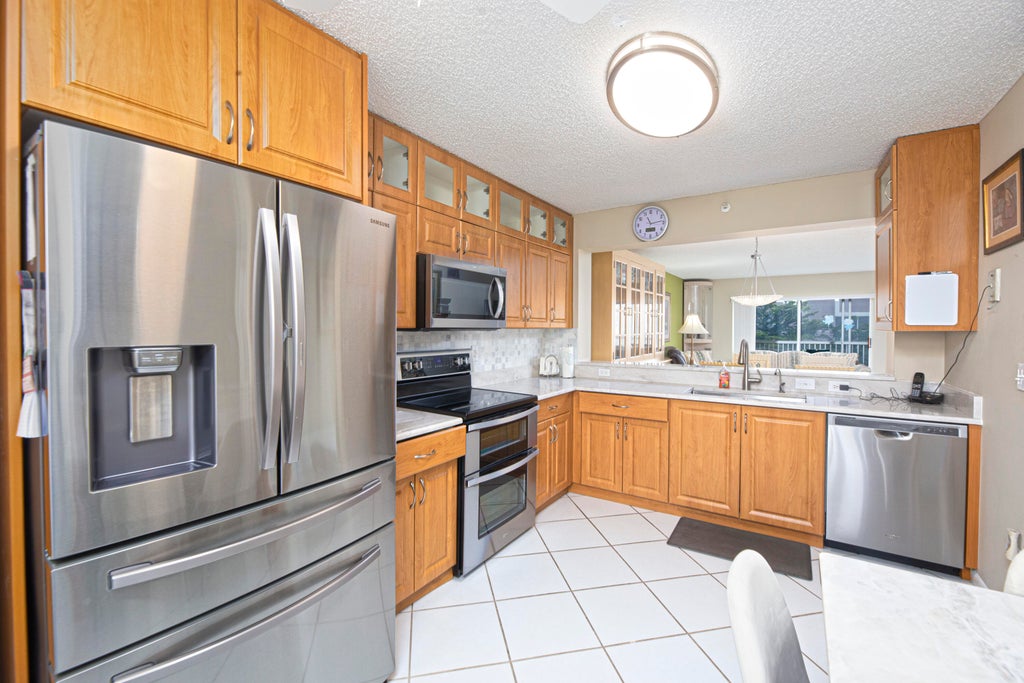 Photo of 9511 Weldon Circle #G416, Tamarac, FL 33321 (MLS # B26083436)