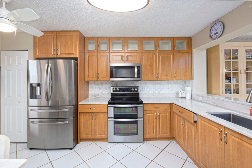 Photo of 9511 Weldon Circle #G416, Tamarac, FL 33321 (MLS # B26083436)