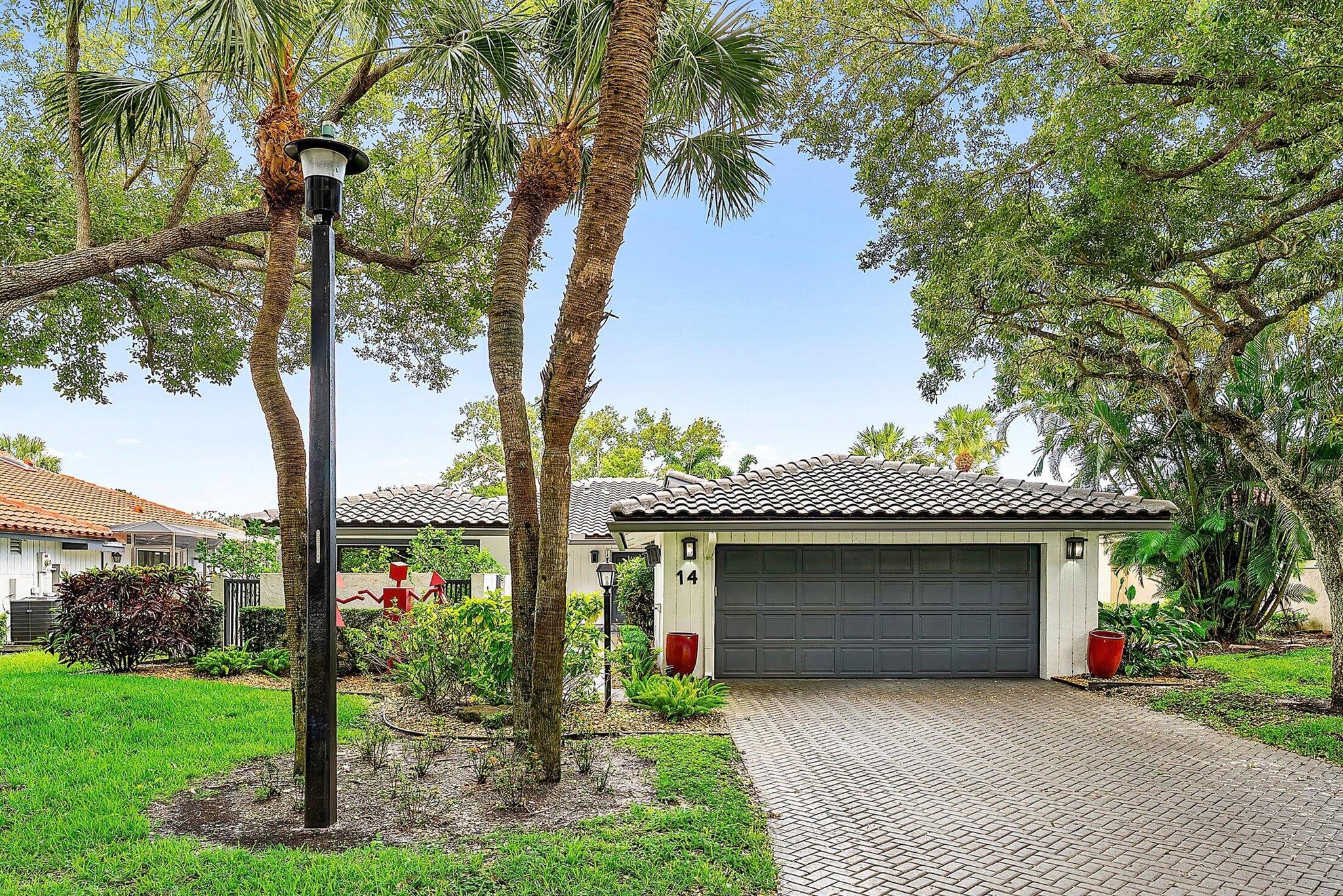 Nestled in The Oaks at Hunters Run Country Club, this exceptional mid-century modern style home offers 2 spacious bedrooms plus a den, with 2.5 bathrooms across 3296 sq-ft. Step inside to a spectacular great room adorned with marble tile, vaulted ceilings, and oversized gable windows with panoramic eastern golf course views. The primary retreat offers two walk-in closets and a private bath, with a separate shower and soaking tub. The secondary bedroom doubles as a den complete with a Murphy bed. An expansive flex-room can be customized to accommodate a third bedroom, family room, and dining area. Exterior highlights include a private front patio, two-car garage, and the Oaks community pool just steps from your front door. Make this your dream home at Hunters Run today!