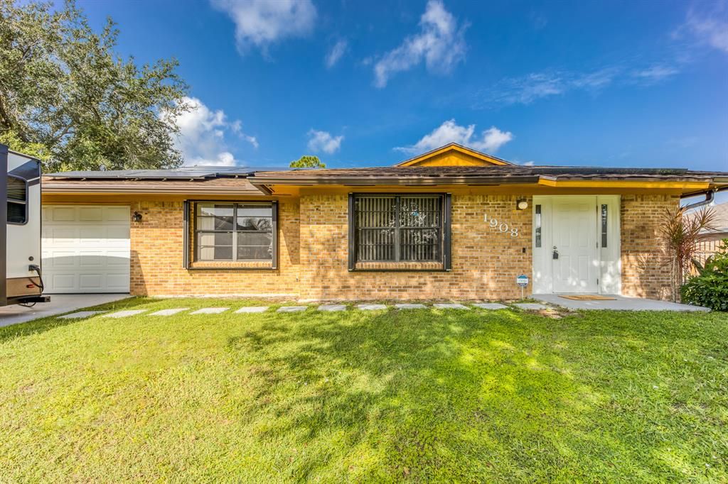 Photo of 1908 SW Ember Street, Port Saint Lucie, FL 34953 (MLS # R10737716)