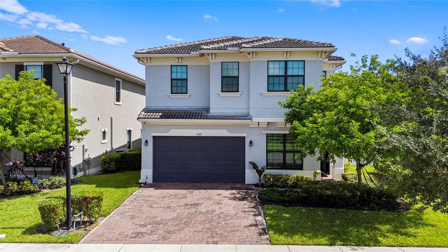 Experience waterfront tranquility and smart living in Coral Springs premier gated community, built in 2020. This 4-bedroom, 3.5-bathroom home offers 3,077 sq ft on a 6,150 sq ft lot, with water views from the terrace, living room, dining area, and master suite. Open-concept layout features a modern kitchen with island and marble tops, electric fireplace, and impact windows & door. A den with garden views can serve as a 5th bedroom, and a private office offers flexibility. Upstairs, a family room, laundry room, and luxurious master suite await. This smart home includes surround sound, cameras, and a fenced backyard with artificial turf and terrace. Enjoy resort-style amenities: clubhouse, fitness center, pool, jacuzzi, playground. Steps from University Drive’s dining, schools, and shopping.