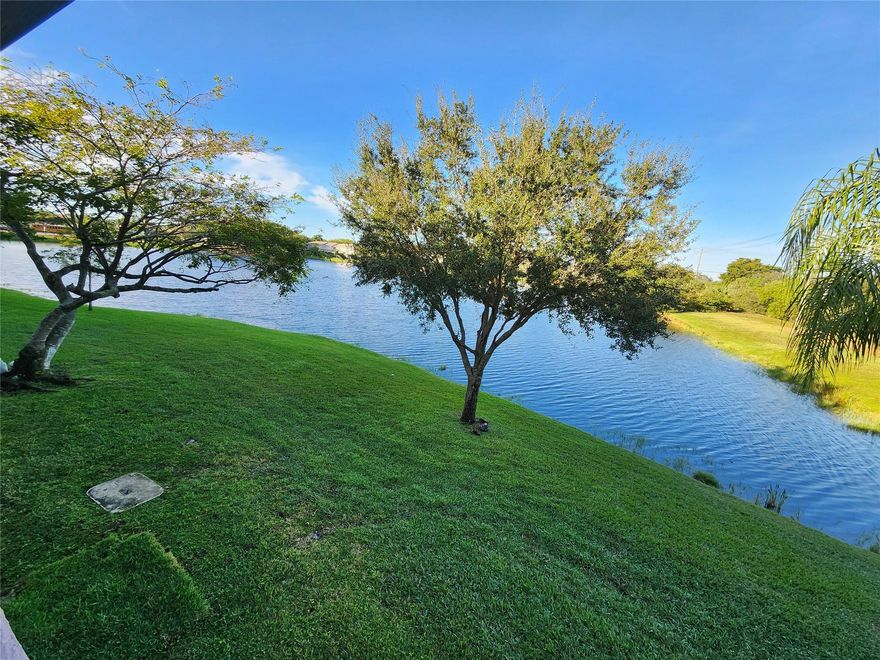 Quiet lake view home with glimpses of the golf course. New flooring and baseboards throughout the home. Updated kitchen appliances, sink and shower fixtures, ETC