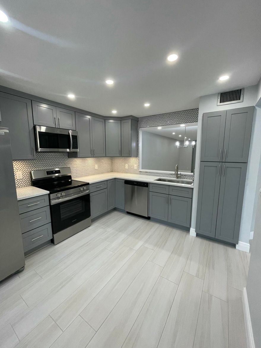 Welcome to this beautifully renovated ground-floor, two-bedroom, two-bath condo with a versatile spare room in the desirable Hamlet at Poinciana. This thoughtfully updated residence features a modern kitchen with sleek finishes, an open and airy floor plan, and upgraded flooring throughout, offering both style and functionality.  Residents of The Hamlet enjoy a vibrant lifestyle with amenities such as a clubhouse, pool, and social activities, all conveniently located near shopping, dining, and major roadways. This is an excellent opportunity to own a fully renovated condo in a highly desirable community—schedule your private showing today!