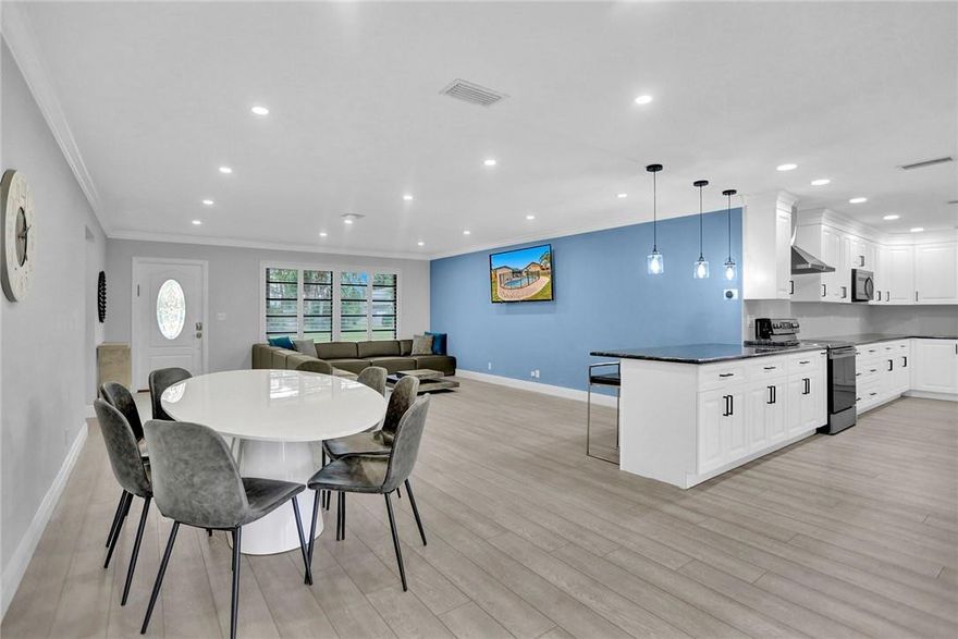 Fully remodeled, waterfront pool home located on a quiet dead-end street in the heart of Cooper City. This bright and spacious 4-bedroom, 2-bath residence offers an open, flowing floor plan perfect for both everyday living and entertaining. The oversized kitchen opens seamlessly to the main living areas, while sliding doors lead to a screened-in patio overlooking the pool, expansive backyard, and tranquil canal views. Enjoy true South Florida living with plenty of outdoor space to relax or host guests. Additional features include a 2-car garage, hurricane shutters, separate laundry room and generous storage throughout. Situated in a highly sought-after neighborhood with A+ rated schools, this home combines privacy, location, and move-in-ready convenience.