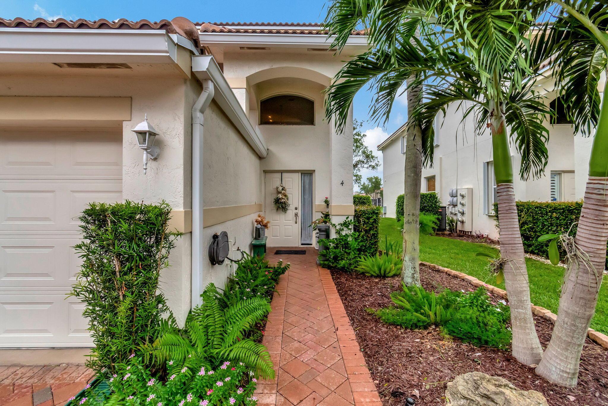 Beautifully updated lakefront coach home in The Grove at Boynton Beach. The furnished seasonal rental features two bedrooms, two full bathrooms, a den/TV room, over 1800 square feet of living space, including a large screened-in patio, perfect for relaxing outdoors, a one-car garage, and a PRIVATE ELEVATOR! 1 small pet under 20lbs. Lake views from the main living areas and the primary bedroom. The Grove has a manned security gate, a newly renovated clubhouse with a fitness center, tennis courts, and a resort-style pool.