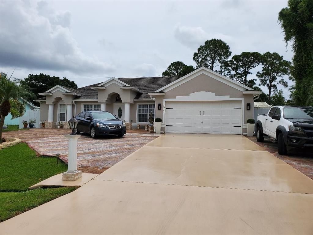 Photo of 1871 SW Mackenzie Street, Port Saint Lucie, FL 34953 (MLS # R10730399)