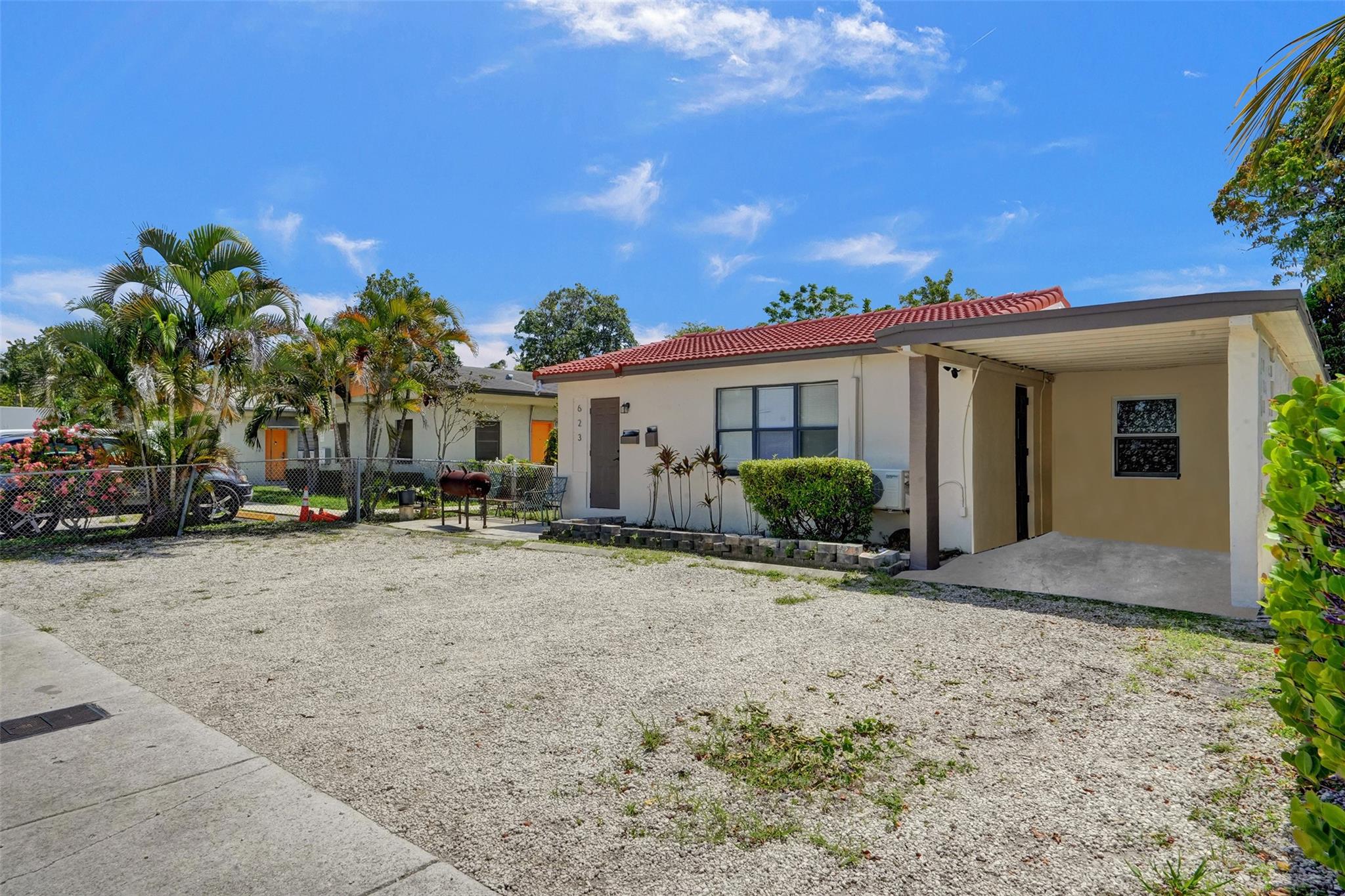 This income-producing triplex is in one of Fort Lauderdale’s hottest rental zones near downtown. The main unit is a 2-bedroom 1-bath with a carport, and there are two 1-bedroom units in back. Recent renovations include updated kitchens and bathrooms. Separate water and electric meters for each unit. Newer roofs on both buildings and a fenced backyard make this a ready-to-go investment. Just a short stroll to the Brightline station and close to shopping and dining on Las Olas Boulevard, Riverwalk’s galleries and riverside parks, and easy access to beaches. Current rents are under market, with potential gross annual income of approximately $74,400.