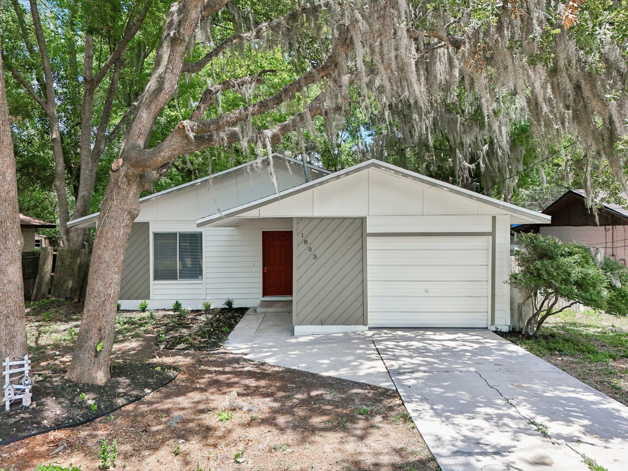 This is a brand new home ready for a new chapter after renovations, featuring a brand-new roof, flooring, exterior/ interior paint, bathroom and kitchen remodels. Attached is a private, large covered porch in the backyard. Come tour this gem in Ocala!