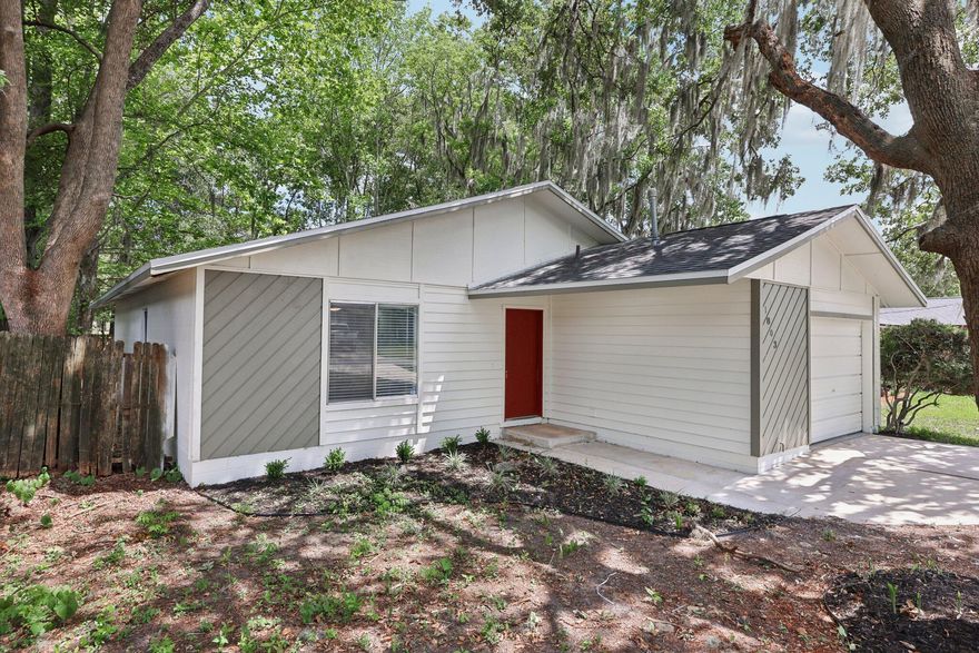This is a brand new home ready for a new chapter after renovations, featuring a brand-new roof, flooring, exterior/ interior paint, bathroom and kitchen remodels. Attached is a private, large covered porch in the backyard. Come tour this gem in Ocala!