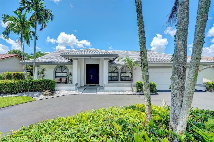 Large, beautiful waterfront home in the lovely West Glen neighborhood in Coral Springs. Five true bedrooms and three full baths. The spacious kitchen is a cook's delight complete with a center island and breakfast area. Formal living room and a charming formal dining room. Soaring vaulted ceilings give this wonderful home an open, dramatic feel. For privacy, the double door entry master bedroom and one additional are on one side of the house. The remaining three on the other side. Master bath has dual sinks and a separate roman tub and shower. The backyard oasis is serene. Perfect for morning coffee on your private, screened patio or a swim in the sparkling pool.  Fruit trees & lush landscaping with a wide canal view make it paradise! 2 car garage. Great schools! Easy access to everything!