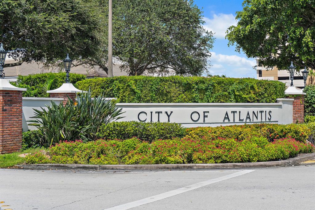 Photo of 437 N Country Club Drive, Atlantis, FL 33462 (MLS # R11127042)