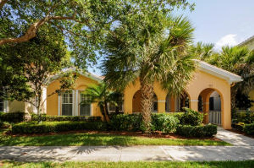 The Mediterranean architecture of this single family home is set among mature oak trees in the picturesque neighborhood of Tuscany at Abacoa. This just feels like home.  The open floor plan and the custom gourmet kitchen make this a must see.  Step inside and your eyes are drawn outdoors, where a screened lanai, marble pavers surrounding the free-form, salt-water pool and a small waterfall cascading at the edge all invite you to enjoy the Florida lifestyle.