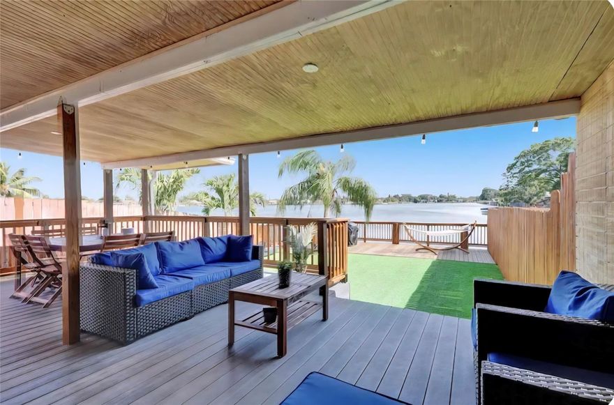 Beautiful, Cozy, completely renovated Lake House featuring three bedrooms, two full baths with Shower Panel Tower, an open kitchen with stainless steel appliances, marble countertops, impact windows, a large fully fenced backyard, a covered patio, and a wood deck with an amazing lake view. The backyard grass is high-quality synthetic grass that always looks beautiful. Easy access to the major highways, restaurants, and synagogues. Must see it! This property is currently listed on Airbnb. Please text the listing agent to confirm availability.