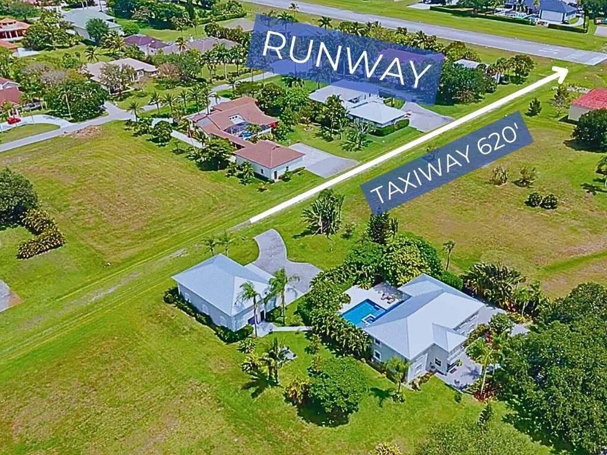 One of the few available pool hangar homes in the prestigious Wellington Aero Club, this 5BR/4.5BA estate has been luxuriously renovated throughout. Set on a 1-acre lot just three lots from the private 4,000' paved runway, the property features a hangar with direct taxiway access. Inside, enjoy a designer Snaidero Italian kitchen with walk-in pantry and keg bar, stunning new bathrooms, a 200SF new primary custom closet, and a spacious in-law suite with kitchenette and cabana bath. Over 1,00SF of new construction additions in the last 2 years. The outdoor kitchen, heated pool, fire pit, extensive mature landscaping and outdoor lighting create perfect entertaining spaces. Please see Supplemental information and walk through video.