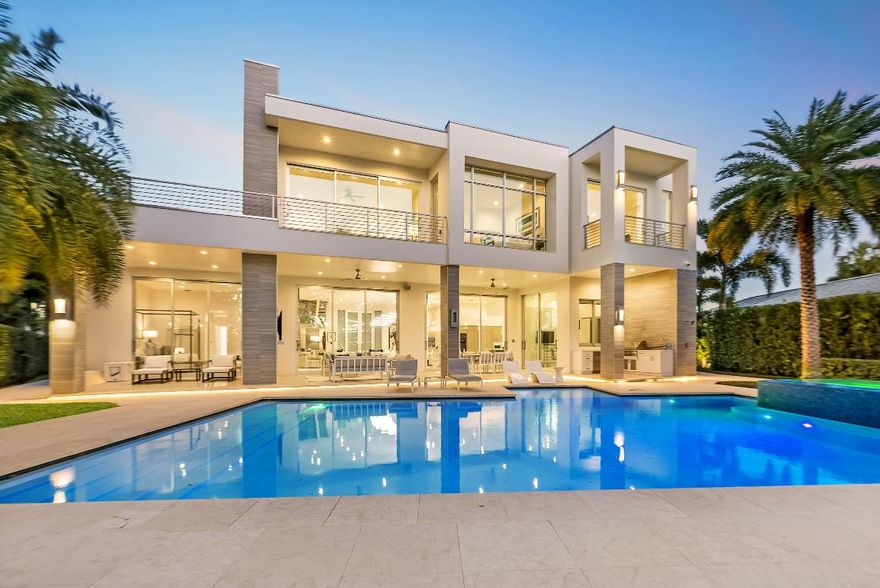 2162 Radnor Rd. - The White Oak Haven
A true Intracoastal masterpiece, The White Oak Haven is a reimagined waterfront fortress, originally built in 2021 and now transformed into a one-of-a-kind estate. Designed by a renowned team, it captures breathtaking Intracoastal sunsets while preserving its expansive, oak-shaded backyard. Nestled in a rare no-wake zone, this nearly one-acre compound seamlessly blends state-of-the-art innovation, elite craftsmanship, and resort-style amenities, delivering an unparalleled luxury lifestyle.

A Home Built Beyond Compare - Security, Innovation & Design
The White Oak Haven is a masterpiece of engineering and luxury, incorporating the most advanced materials and technology available. The home's Swiss-engineered 15-foot floor-to-ceiling impact glass sliders with bank-vault-style locking mechanisms provide unmatched security while seamlessly merging indoor and outdoor living. The first-of-its-kind impact-rated glass garage doors add to the home's aesthetic appeal and durability, offering ample space for car lifts and high-end vehicle storage. Designed with unrivaled efficiency and climate control in mind, the entire estate is insulated with Icynene blown insulation, ensuring optimal comfort year-round.

A full-house generator ensures that this home is fully powered at all times, providing peace of mind no matter the circumstances. The entire estate is fully integrated with a Control4 automation system, allowing you to control lighting, security, climate, and entertainment from anywhere in the world. To complement this, five high-powered WiFi boosters have been installed to extend high-speed internet coverage across the entire estateeven out by the boat dock.

The Ultimate Chef's Kitchen - Reimagined & Expanded
The heart of this home is a masterfully redesigned chef's kitchen, where elegance meets world-class functionality. Thoughtfully curated for effortless entertaining, it boasts top-tier appliances, including dual dishwashers, double ovens, and a built-in Miele coffee, espresso, and cappuccino maker. A Sub-Zero refrigerator and freezer, counter-inset fridge drawers, microwave, induction cooktop, and wine cooler provide exceptional storage and convenience. The grand center island doubles as both a premier culinary workspace and an inviting gathering spot. Every detail from the custom cabinetry to the precision-crafted finishes ensures a seamless blend of luxury and practicality.


Grand Living Spaces & Resort-Style Design
Designed for both privacy and entertainment, The White Oak Haven offers an expansive and versatile layout with five en-suite bedrooms, plus two additional rooms tailored for ultimate flexibility one serving as a dedicated office off the kitchen and the other as a fully equipped gym.
The primary suite, located on the first floor, has been completely reimagined, featuring a luxurious spa-inspired bath and a separate glass-enclosed shower, all finished with the finest hand-selected materials. Nearby, a secondary en-suite bedroom conveniently positioned near the garage entry and first-floor laundry serves as a private retreat, ideal for in-laws, a nanny, or visiting guests. Adjacent to the kitchen, a private office with direct access to the pool deck offers a serene workspace with breathtaking waterfront views.
Upstairs, three master-sized en-suite bedrooms open to expansive terraces, offering stunning views of the Intracoastal, lush greenery, and the resort-style pool and spa. A sprawling upstairs loft provides an additional entertainment area, perfect for a media lounge, game room, or relaxation space. Completing this home's exceptional amenities is a professionally outfitted gym, equipped with high-end fitness equipment, ensuring a premier workout experience without ever leaving home.

Resort-Style Outdoor Living & Boating Paradise
The White Oak Haven is designed for those who demand the pinnacle of waterfront luxury and outdoor living. The resort-style pool and spa boast an expansive marble coquina deck and a full-length marble entry step hallmarks of the world's finest estates. A newly installed marble walkway extends from the garage, where an industrial-grade ice machine is housed, all the way to the private dock, ensuring seamless transport of fishing gear, water toys, and water sports equipment.
For boating enthusiasts, this home offers an impressive 40,000-lb boat lift, currently home to a $2M 2023 Valhalla center console. Designed to accommodate nearly any high-performance center console, the dock and lift provide a safe, secure, and convenient storage solution. The entire estate is elegantly illuminated by newly installed stainless steel outdoor lighting and hardwired accent fixtures, ensuring a striking presence both day and night while being completely rust-proof and built to withstand the elements.
Tucked privately to the side of the property, a professional-grade sports court offers the ultimate in outdoor recreation. Outfitted with pro-league outdoor lighting and premium sports flooring, this space serves as both a basketball and pickleball court, providing ample room for multiple games and activities. Whether engaging in a competitive daytime match or enjoying a night game under stadium-quality lighting, this court adds a rare and highly coveted feature to an already unmatched estate.
Prime Location - The Best of the Best
Situated in one of South Florida's most prestigious waterfront enclaves, between PGA Boulevard and Donald Ross Road on the east side of the Intracoastal Waterway, The White Oak Haven offers an unparalleled level of privacy while remaining just minutes from the area's finest attractions. World-class dining, high-end shopping, pristine beaches, and elite entertainment are all within easy reach.
One of the estate's greatest advantages is its proximity to The Benjamin School, one of Florida's most prestigious private institutions, located less than two minutes away making school drop-offs effortless and convenient.
With direct Intracoastal access and no fixed bridges, this estate is a true boater's dream, offering a quick and scenic ride to the ocean and placing you in one of the most desirable yachting locations in all of South Florida.
A Once-in-a-Lifetime Opportunity
The White Oak Haven is more than just a home it is a statement of prestige, engineering mastery, and elite craftsmanship. Offering an unparalleled blend of innovation, security, and luxury waterfront living, this estate is designed to outperform, outlast, and impress. With world-class amenities, a breathtaking Intracoastal setting, and an unrivaled location, this is a rare opportunity to own a true masterpiece of ultra-luxury real estate.
Positioned on a quiet, exclusive street in one of South Florida's most desirable waterfront locations, this estate surpasses all expectations. Opportunities like this are exceedingly rare schedule your private tour today and experience the pinnacle of Intracoastal luxury.