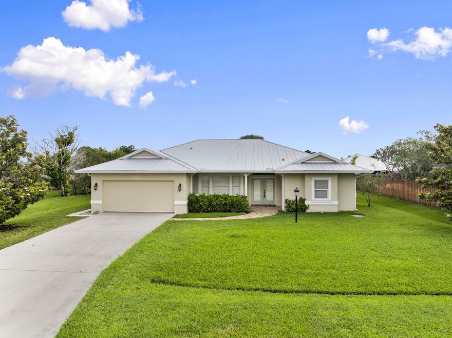Beautifully maintained GEM Builders CBS constructed home located in a desirable Port St. Lucie neighborhood. A welcoming French door entry opens to a spacious floorplan with sliders that overlook the screened patio and pool area. The master suite features his and her walk-in closets and a generously sized bathroom complete with a soaking tub, separate glass enclosed shower, and dual sinks. The wraparound kitchen offers excellent functionality with a built-in desk, above cabinet lighting, and high-top counter seating. Multiple sliders lead out to the screen enclosed pool and covered patio, thoughtfully designed with a private cabana bathroom for added convenience. The beautifully landscaped yard includes a sprinkler system on well and a storage shed for additional space. This home is conveniently located within minutes of Publix, gas stations, the Fire department, Sheriff's department, post office, and I 95, offering quick access to everyday essentials and easy commuting. Meticulously cared for and move in ready, this home combines solid construction with a functional, comfortable layout.