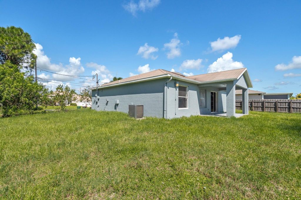 Photo of 3973 SW Wycoff Street, Port Saint Lucie, FL 34953 (MLS # F10411838)