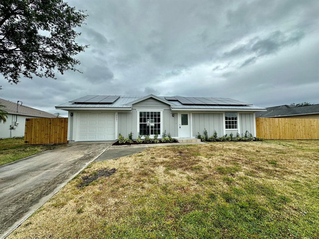 Photo of 2061 SW Burman Lane, Port Saint Lucie, FL 34984 (MLS # R10980853)