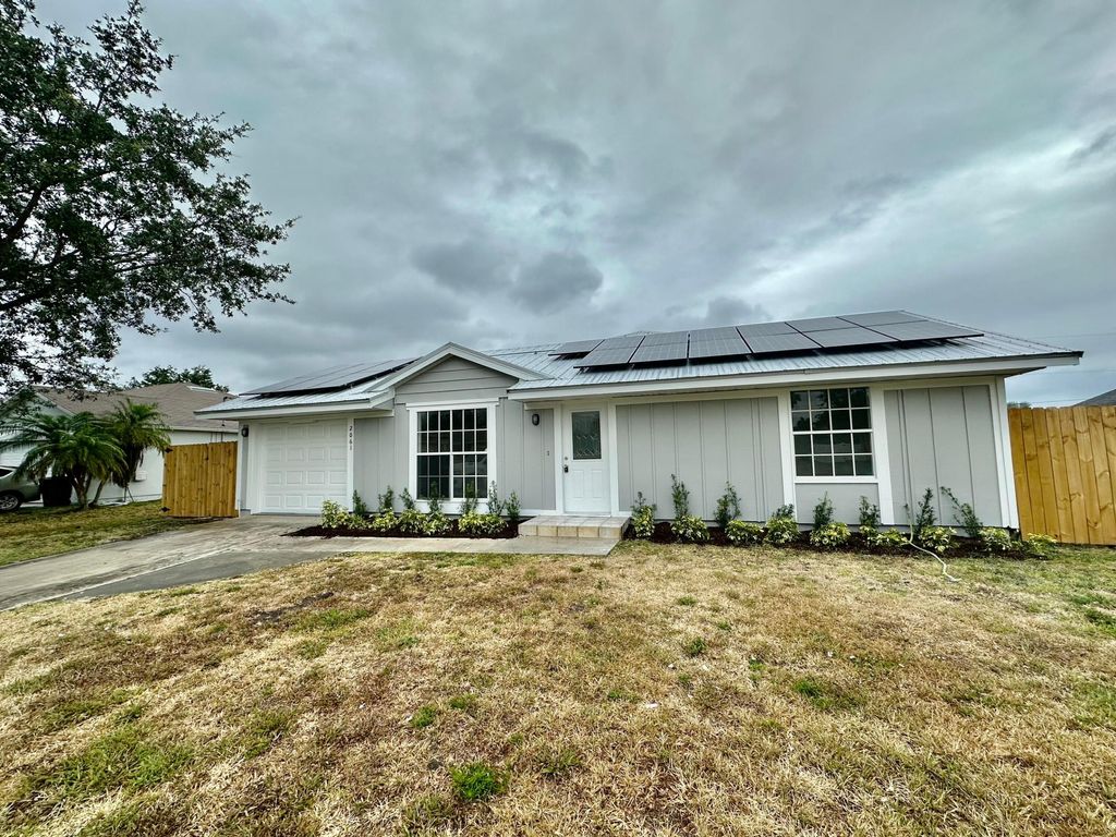 Photo of 2061 SW Burman Lane, Port Saint Lucie, FL 34984 (MLS # R10980853)