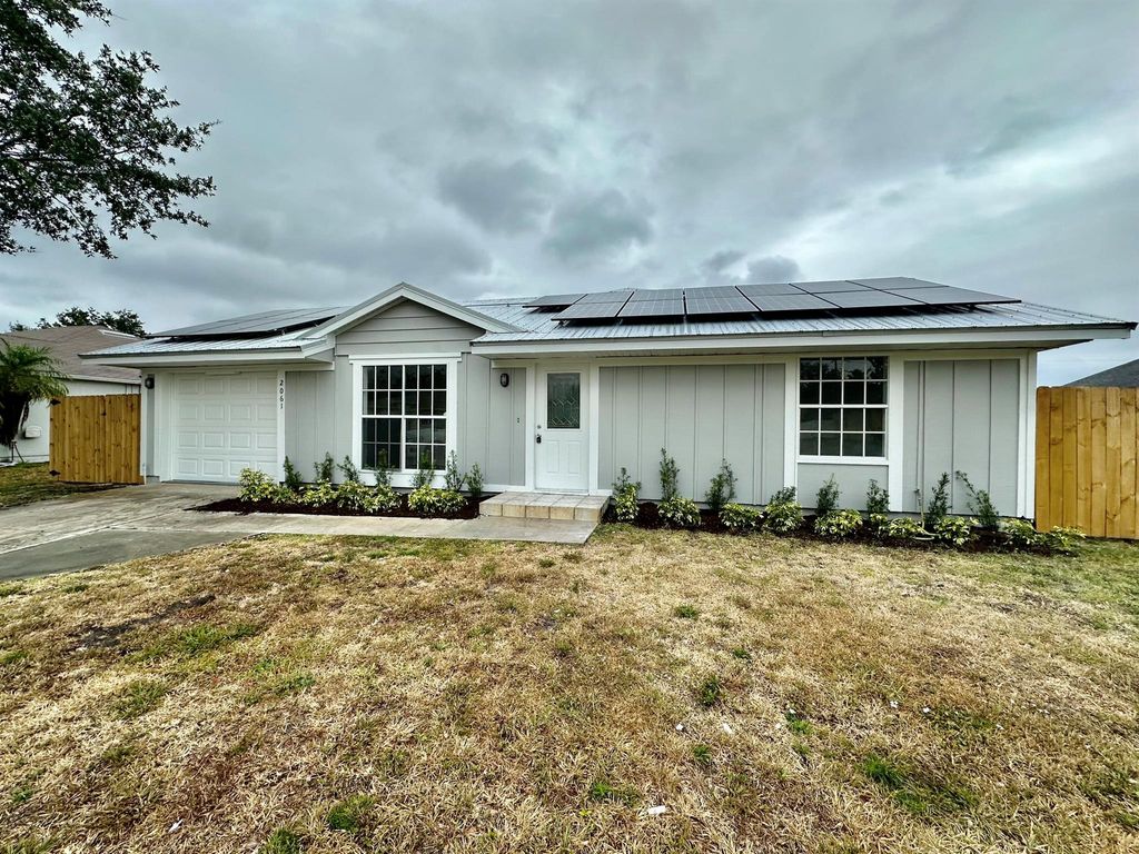 Photo of 2061 SW Burman Lane, Port Saint Lucie, FL 34984 (MLS # R10980853)