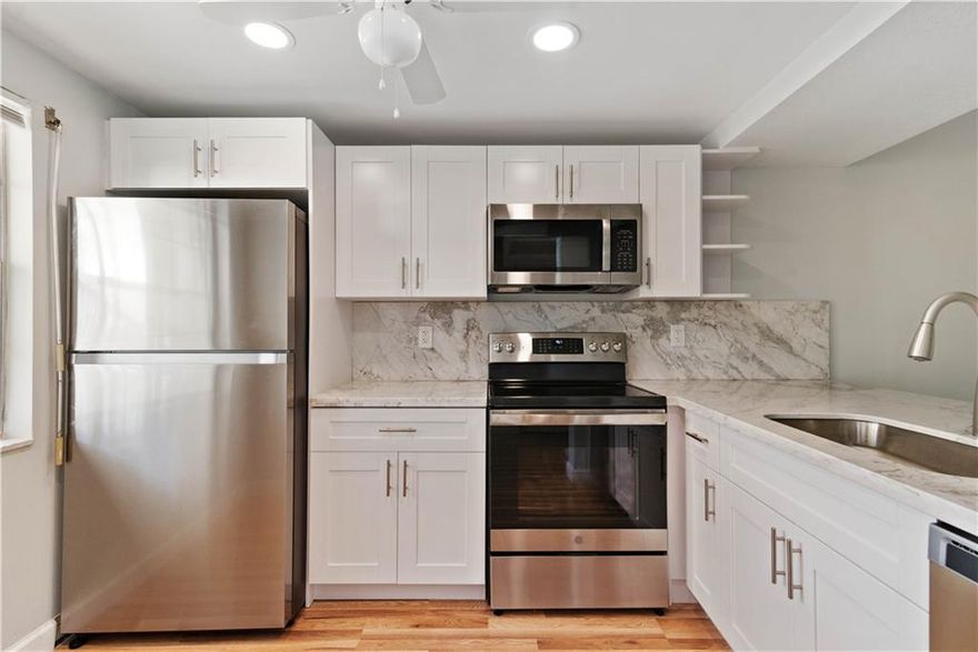 Beautiful 962 sq. ft. 1 bedroom 1 1/2 bath condo has a new kitchen just completed (2022) w/white shaker cabinets, white & gray granite counter-tops & stainless steel appliances. Master bathroom has a new vanity, toilet & tile floor (2022). New 2-ton Rheem AC unit (2021 w/10-year warranty), electrical panel (2020), upgraded plumbing (2020), water heater (2019), & laminate floors throughout (2019). Spacious screened patio w/new tile floor overlooking the garden. Wynmoor Country Club, an active 55+gated community, amenities include multiple heated swimming pools (1 walking/exercise pool), golf, pickleball, tennis, exercise/walking/bike path, fitness center w/sauna, billiards & ping pong, card games, many clubs and classes, movie theatre, & cafe. Convenient to shopping.